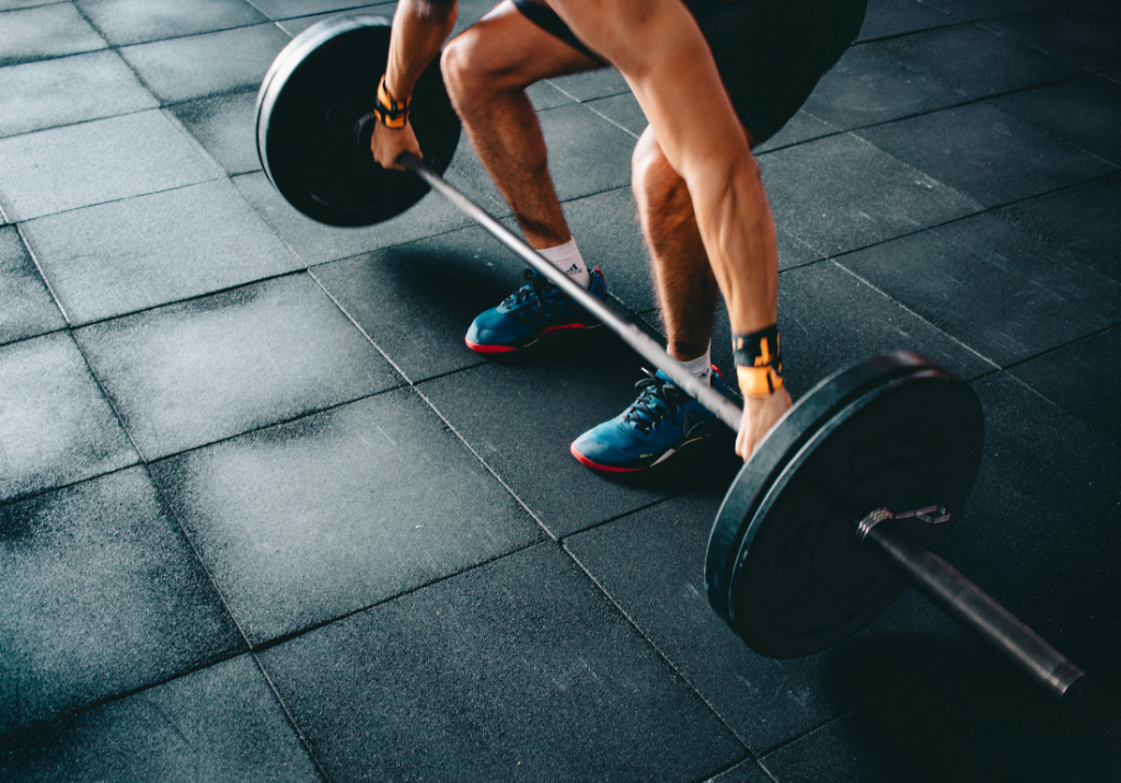 Person lifting barbell in a workout